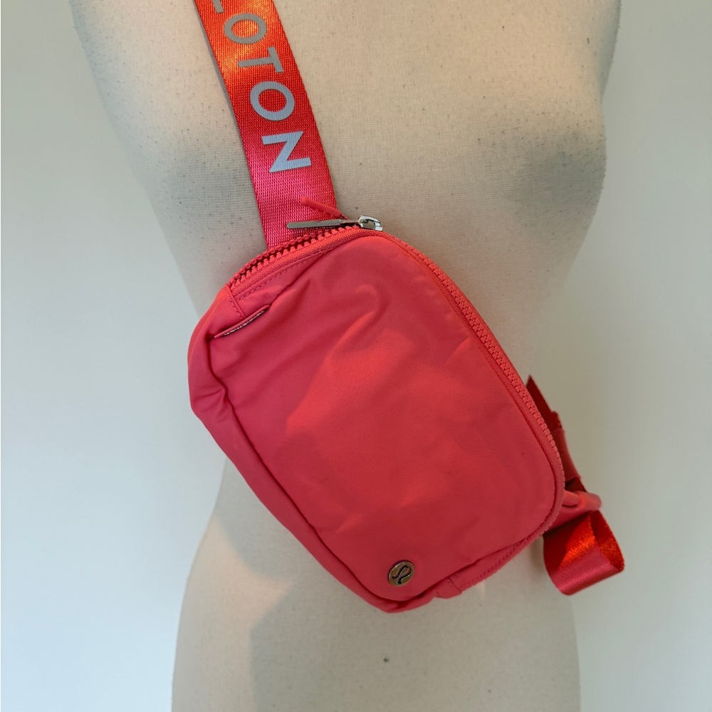 Peloton Coral Pink Branded Strap Sling